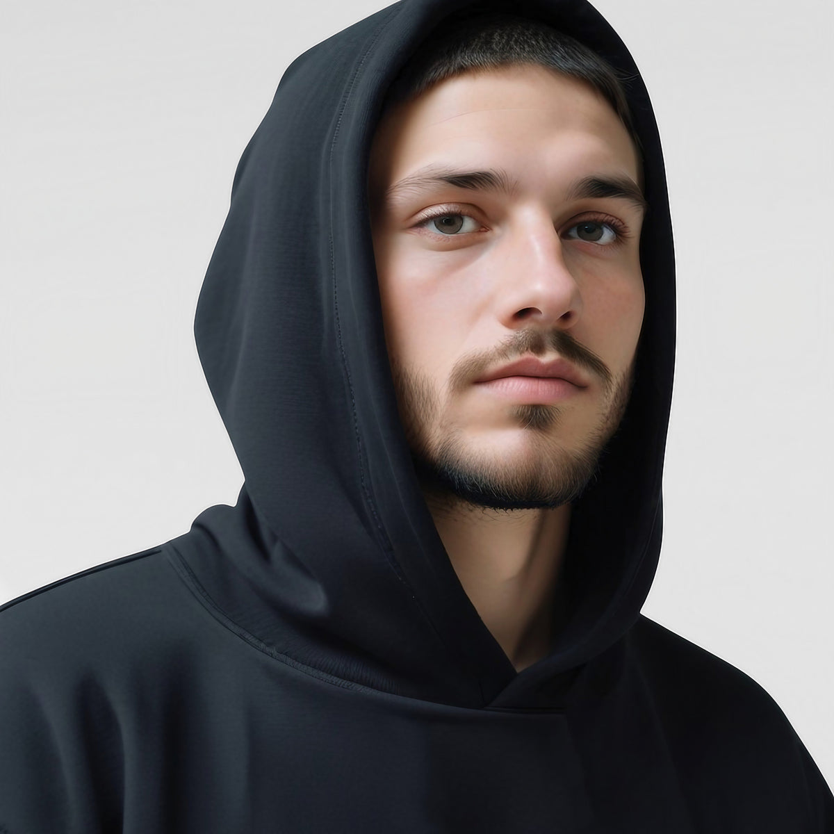 Men's Oversized Pullover Hoodie in Black - alternate angle showing fit and fabric detail