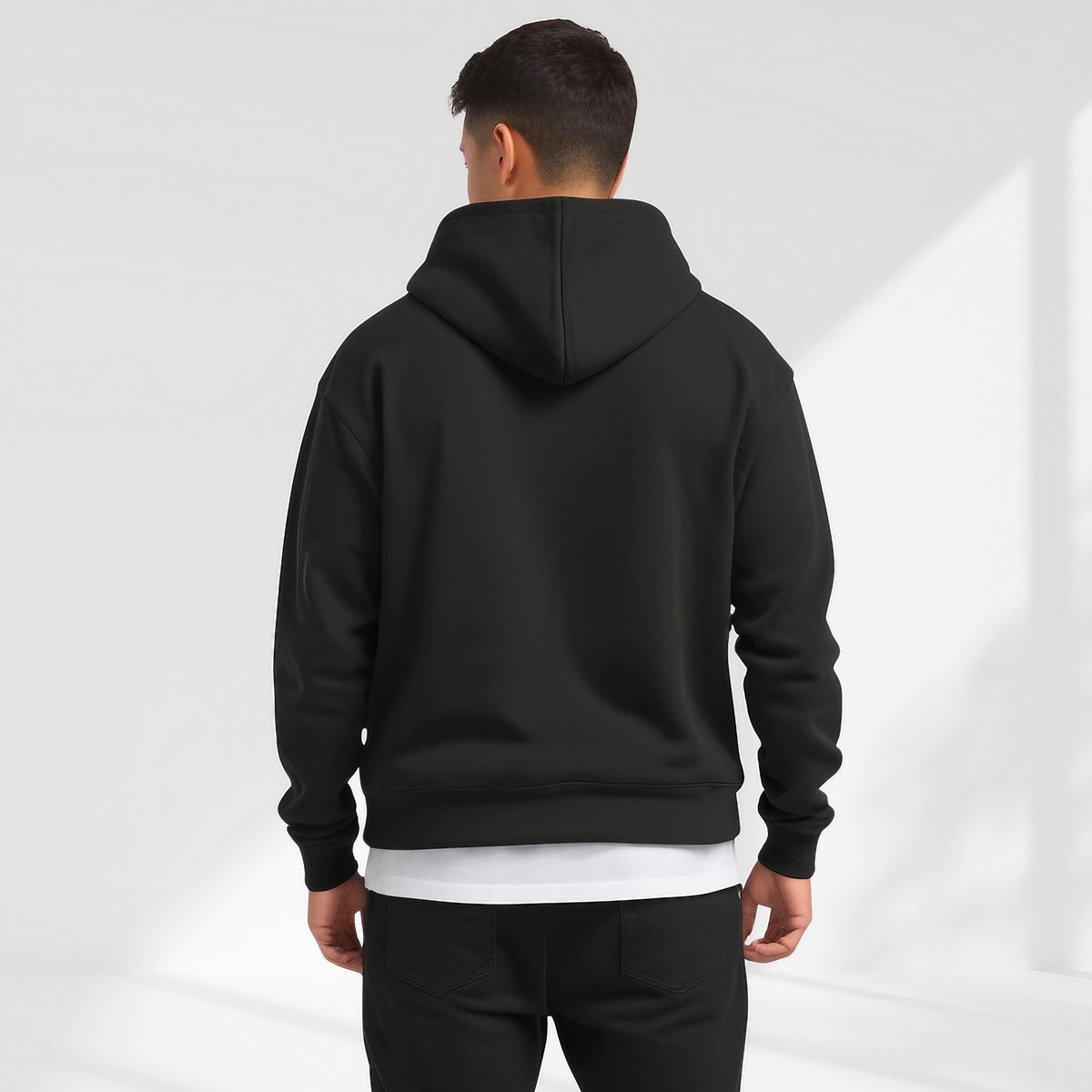 Men's Oversized Pullover Hoodie in Black - alternate angle showing fit and fabric detail