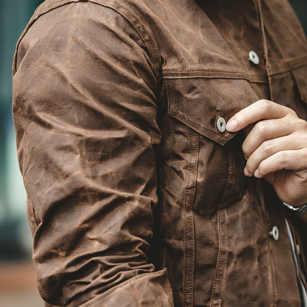 Men's Waxed Canvas Trucker Jacket in Brown - alternate angle showing fit and fabric detail
