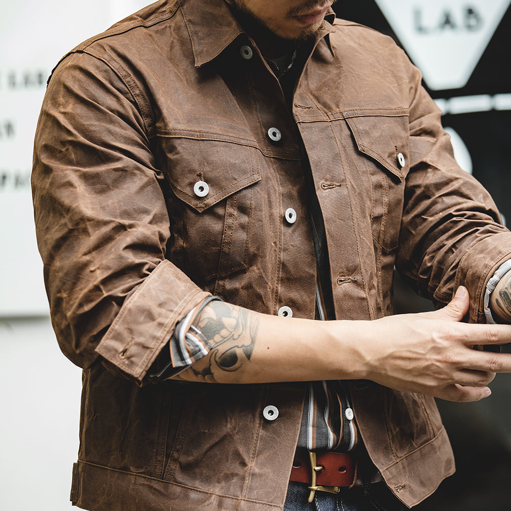 Men's Waxed Canvas Trucker Jacket in Brown - alternate angle showing fit and fabric detail