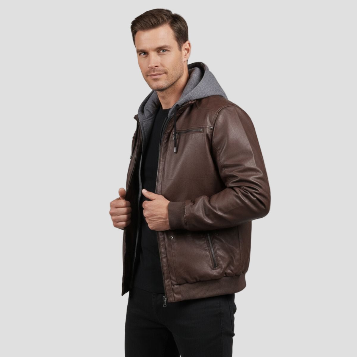 Men's Faux Leather Bomber Jacket with Jersey Hood in Black - alternate angle showing fit and fabric detail