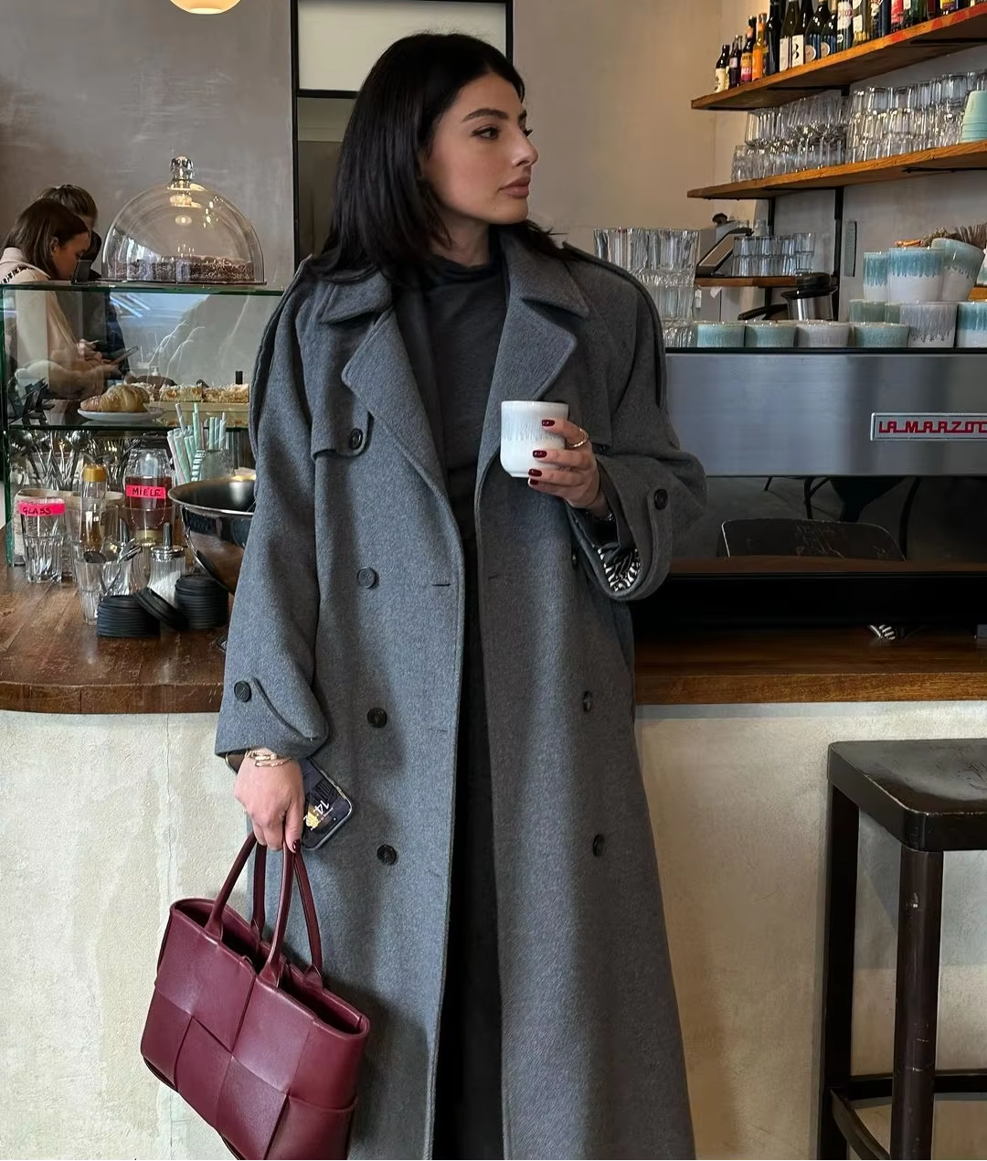 Women's Long Double-Breasted Trench Coat in Bordeaux - alternate angle showing fit and fabric detail