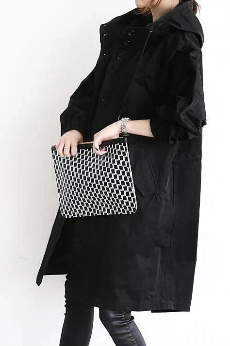 Women's Hooded Long Rain Jacket in Black - alternate angle showing fit and fabric detail
