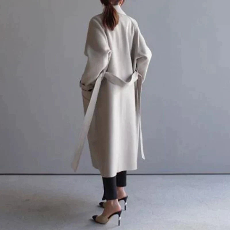 Women's Oversized Double-Breasted Long Coat in Beige - alternate angle showing fit and fabric detail